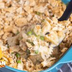 spoonful of the dish hovering over the casserole