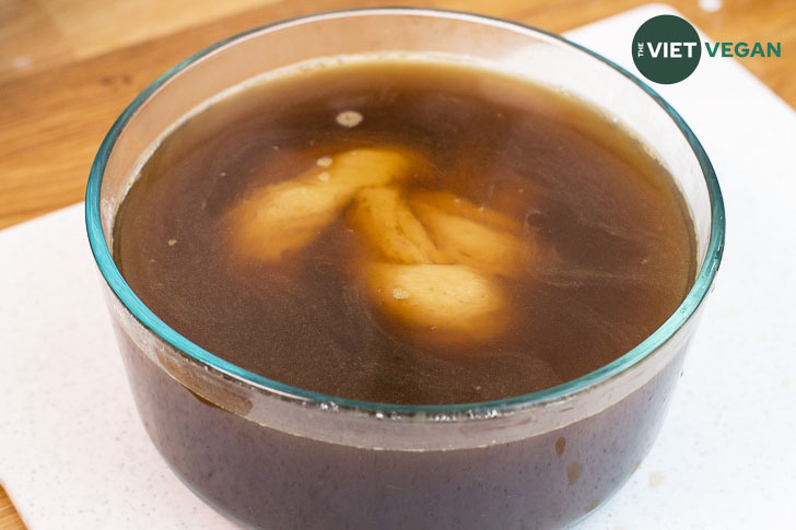 Seitan knot chilling in broth