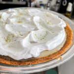 vegan key lime pie with whipped cream on top