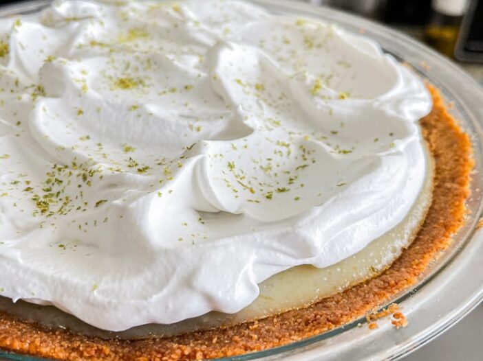 vegan key lime pie with whipped cream on top