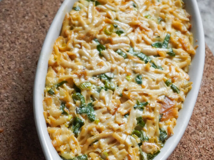 Smoked tofu mixed with vegan mayo spread over rice, baked in an au gratin dish