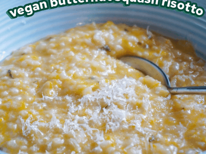 vegan butternut squash risotto in a blue bowl topped with vegan parmesan