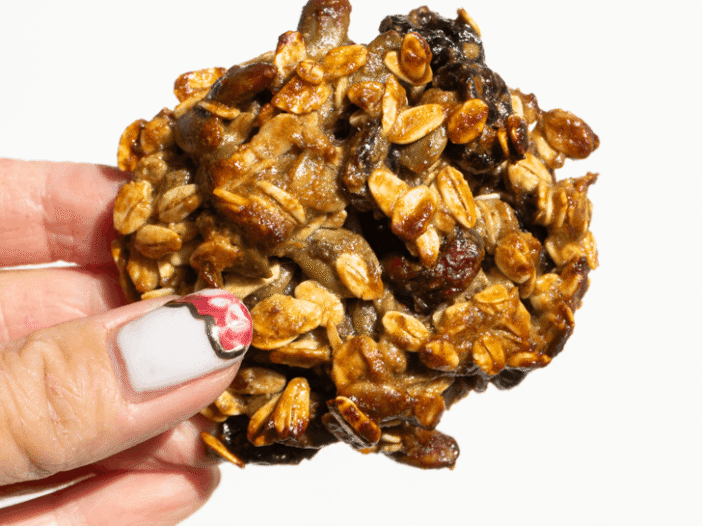 vegan breakfast cookie, held up in the sunlight